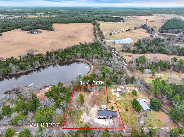 aerial view featuring a rural view and a water view