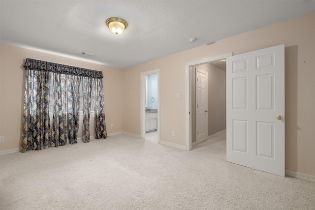 unfurnished room with light colored carpet