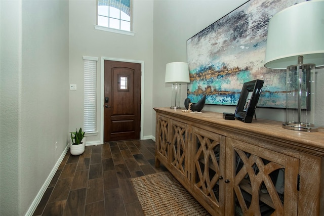 foyer entrance with a high ceiling