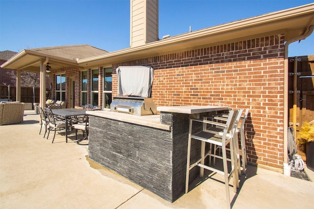 view of patio / terrace with exterior bar