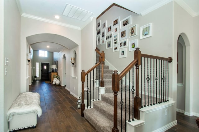 staircase featuring crown molding