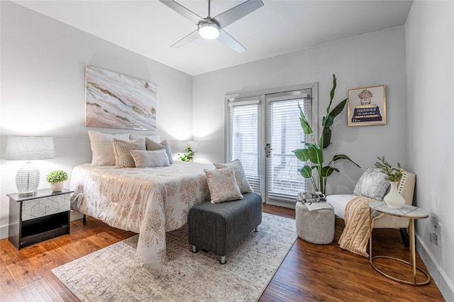 bedroom with dark wood-type flooring, ceiling fan, and access to exterior