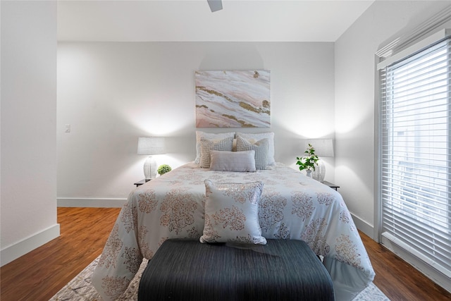 bedroom with hardwood / wood-style floors and ceiling fan