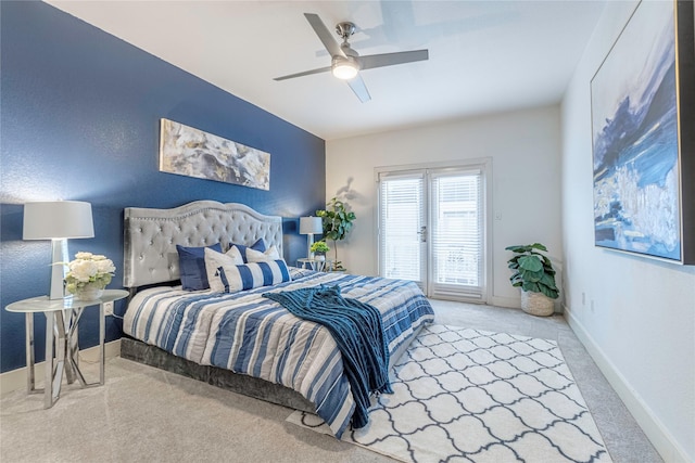 carpeted bedroom featuring access to exterior and ceiling fan