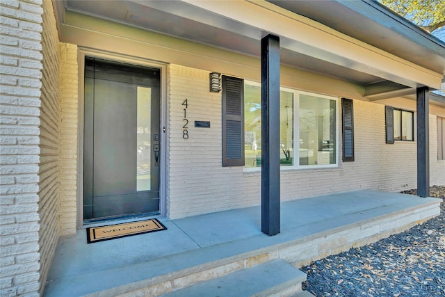 entrance to property with a patio