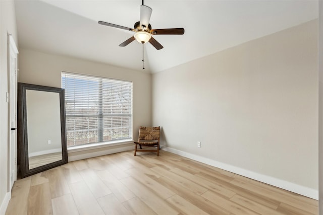 unfurnished room featuring light hardwood / wood-style flooring, ceiling fan, and vaulted ceiling