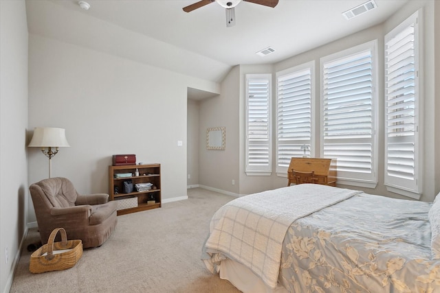 carpeted bedroom featuring vaulted ceiling and ceiling fan