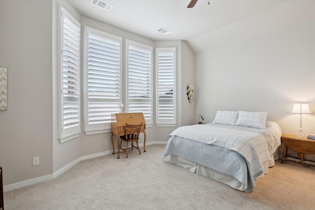 bedroom featuring ceiling fan and light carpet