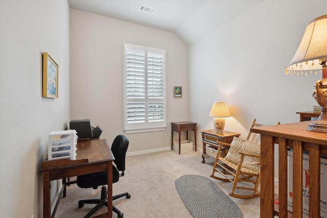 carpeted office with vaulted ceiling