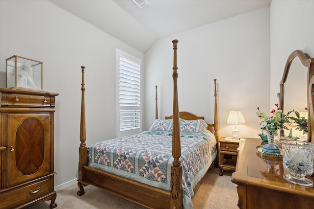 carpeted bedroom featuring lofted ceiling