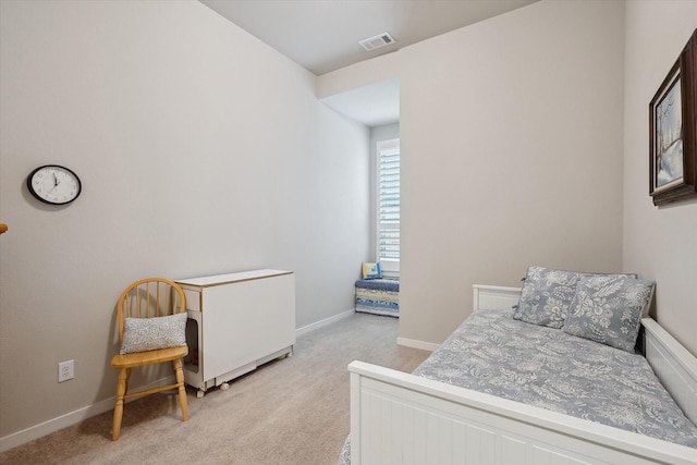 bedroom with light carpet