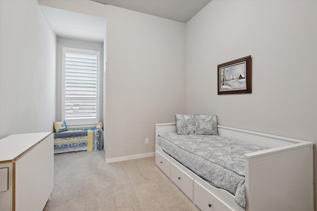 bedroom featuring light colored carpet