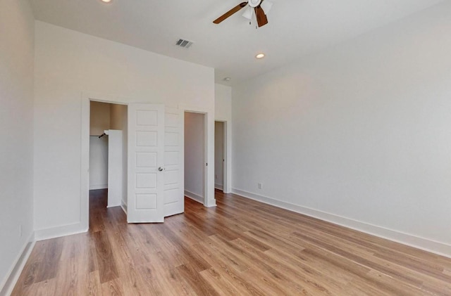 unfurnished bedroom featuring light hardwood / wood-style floors and ceiling fan