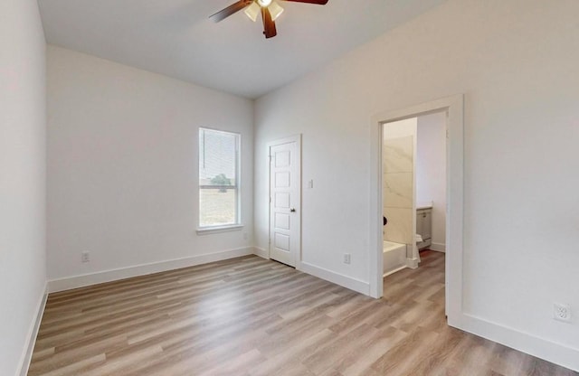 spare room featuring light hardwood / wood-style flooring and ceiling fan