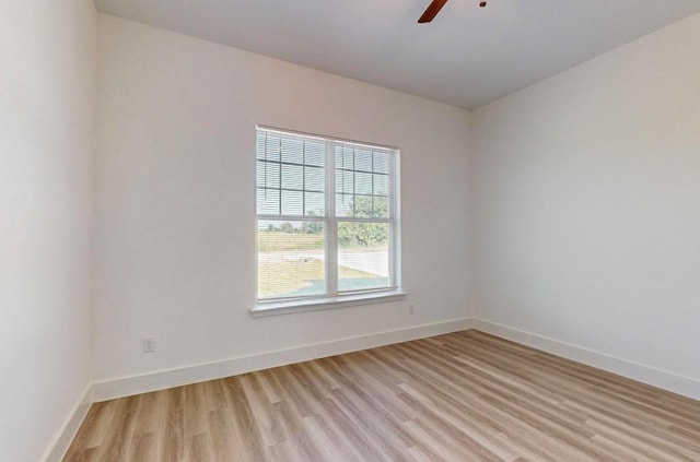 empty room featuring light hardwood / wood-style floors and ceiling fan