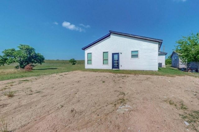 rear view of house with central AC