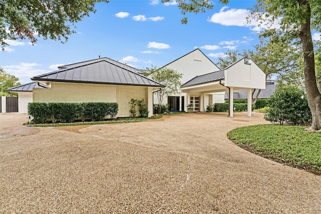 view of front of property with a carport