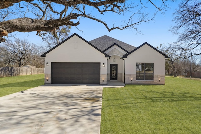 view of front of property with a garage and a front lawn