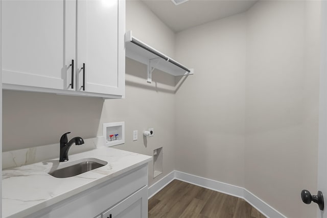 clothes washing area with sink, cabinets, washer hookup, dark hardwood / wood-style flooring, and hookup for an electric dryer