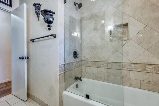 full bath featuring shower / washtub combination, baseboards, and tile patterned floors