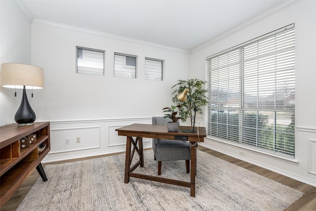 office area featuring hardwood / wood-style floors and crown molding