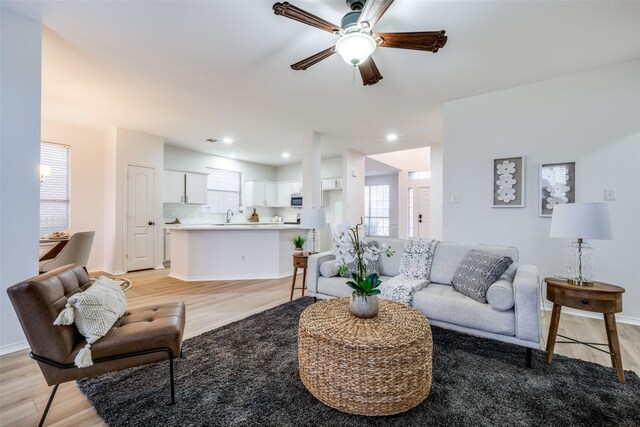 foyer entrance featuring ceiling fan and light hardwood / wood-style floors