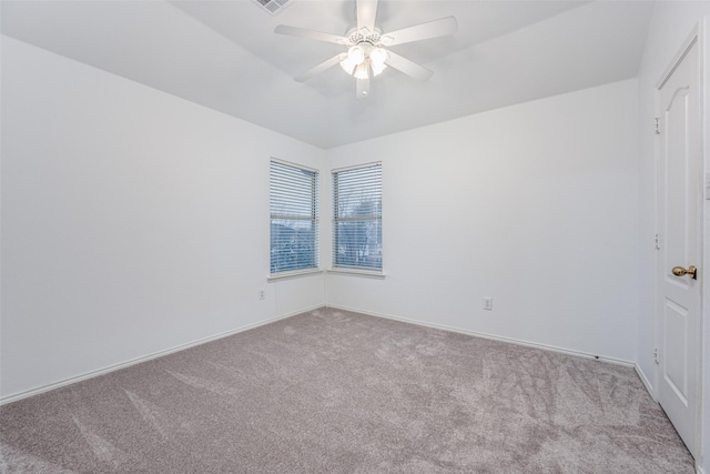 spare room with light carpet and ceiling fan