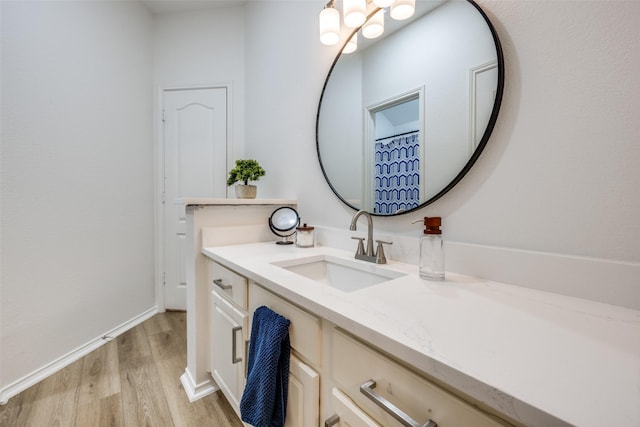 bathroom with vanity and hardwood / wood-style floors