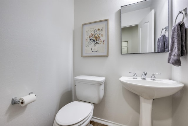 bathroom with sink and toilet