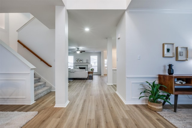 foyer featuring ceiling fan and light wood-type flooring