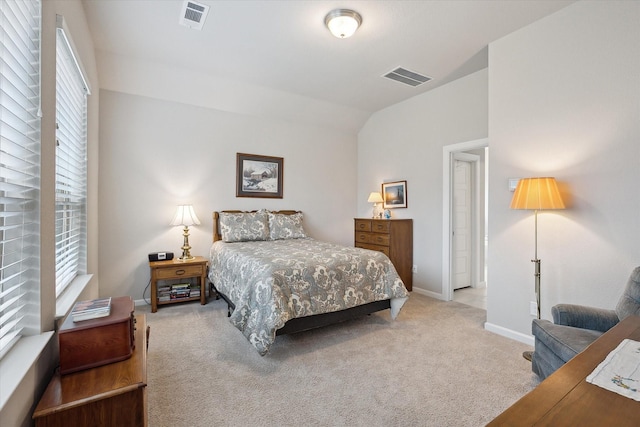 carpeted bedroom featuring vaulted ceiling