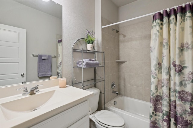 full bathroom featuring shower / bathtub combination with curtain, vanity, and toilet