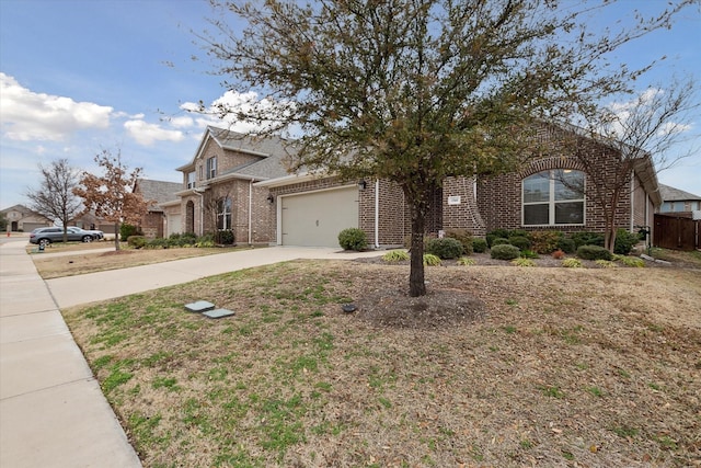 view of front of property with concrete driveway, brick siding, and an attached garage