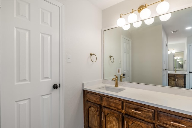 bathroom featuring visible vents and vanity