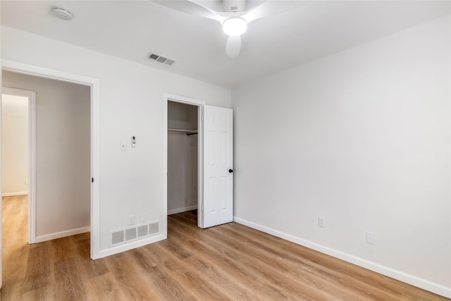 unfurnished bedroom featuring light wood-type flooring, visible vents, and baseboards