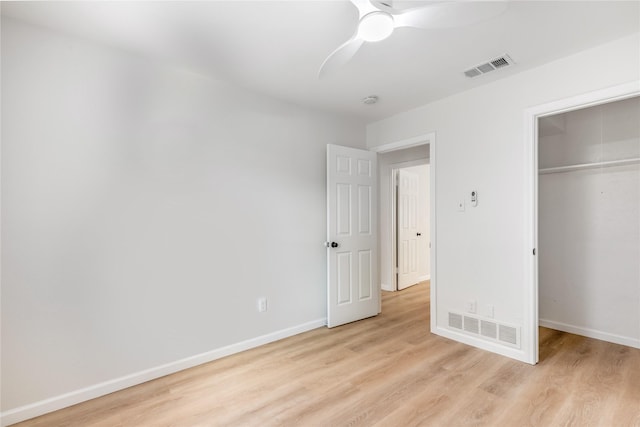 unfurnished bedroom featuring visible vents, light wood-style flooring, and baseboards