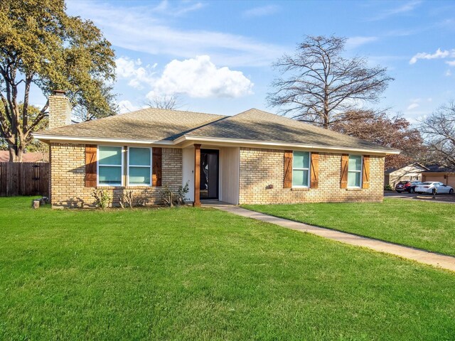 ranch-style home with a front yard