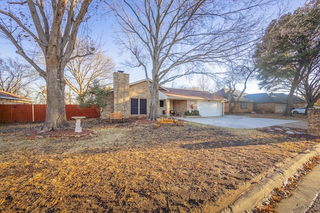 ranch-style home featuring a garage