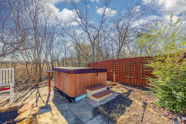 view of patio / terrace featuring a hot tub