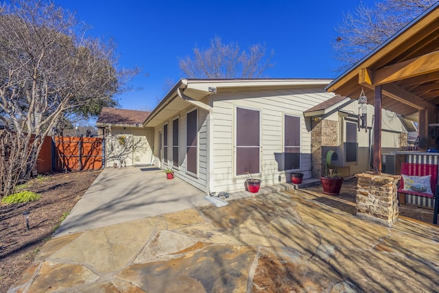 view of side of home featuring a patio area