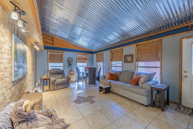 living room with lofted ceiling, wooden ceiling, brick wall, and light tile patterned flooring