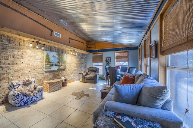 tiled living room featuring lofted ceiling, brick wall, and wooden ceiling