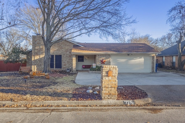 ranch-style home featuring a garage