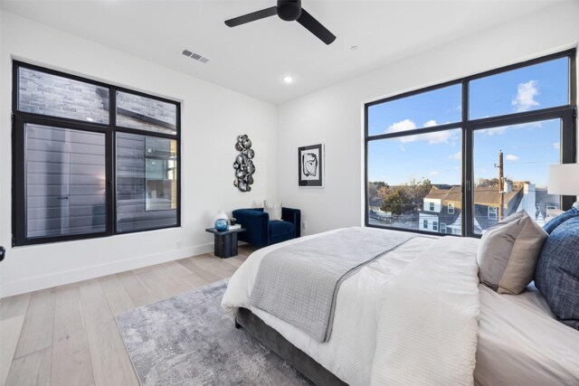 bedroom featuring light hardwood / wood-style flooring and ceiling fan