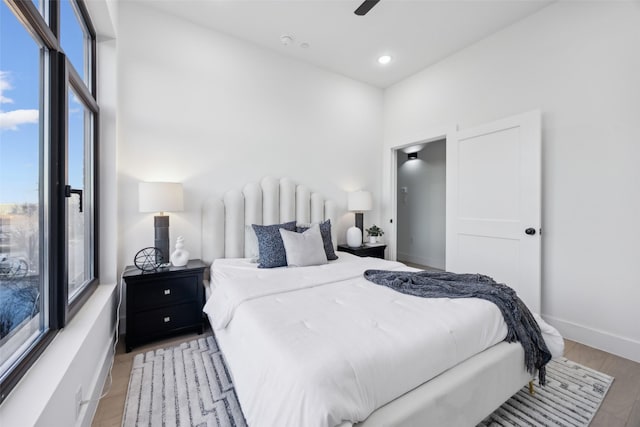 bedroom with ceiling fan and light wood-type flooring