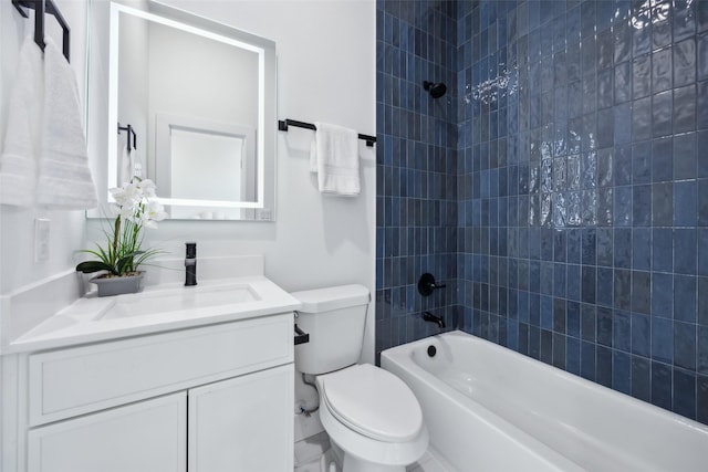 full bathroom with vanity, toilet, and tiled shower / bath