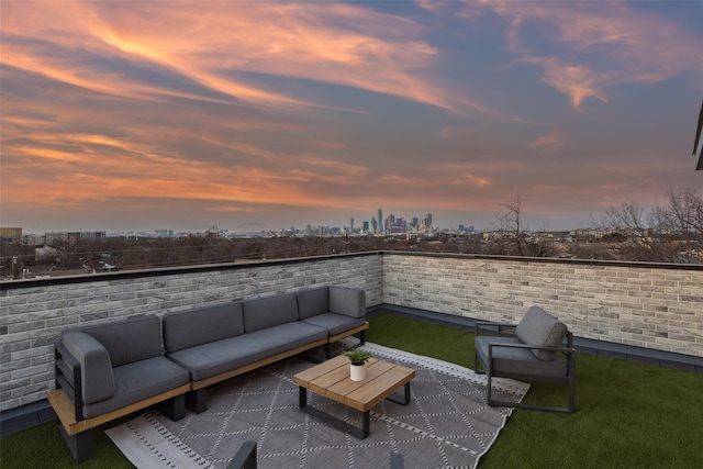 patio terrace at dusk with an outdoor hangout area