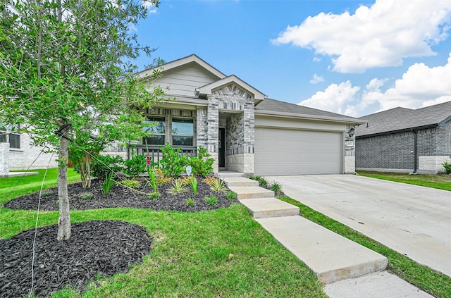 view of front of property with a garage and a front yard