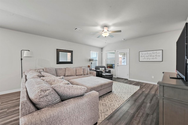 living room with lofted ceiling, dark hardwood / wood-style floors, and ceiling fan