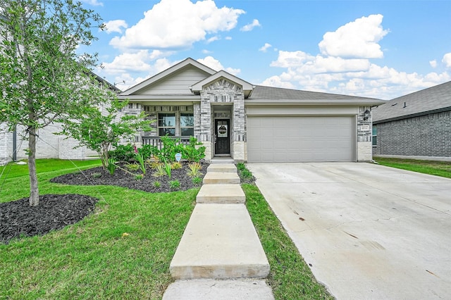 view of front facade featuring a garage, a porch, and a front yard